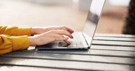 Hands, woman and typing on laptop outdoor for research, reading email and proofreading article....