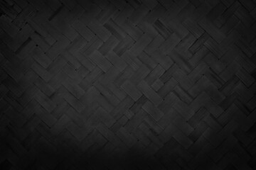 Old black bamboo weave texture background, pattern of woven rattan mat in vintage style.