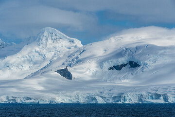 Icebergs and Glaciers align the coast of the Antarctic peninsula, and its many islands. Image taken...