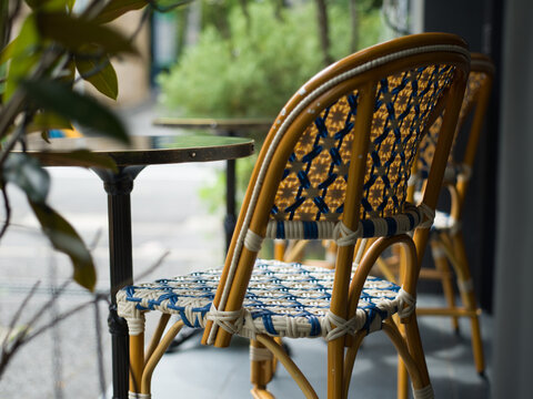Outdoor caf&eacute; table and rattan chair