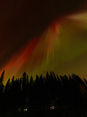 Spectacular displays of shimmering light from Aurora Borealis in the night sky. It was an amazing display of the Northern Lights
