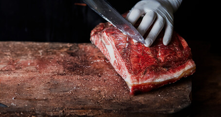 cutting meat on a cutting board