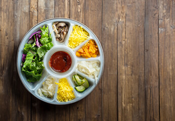 Various vegetables in packaging containers, bibimbap