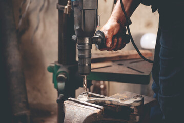 Mechanic Men hands use grinder Welding Hot flame metal work cutting fire iron workshop. Repairman...