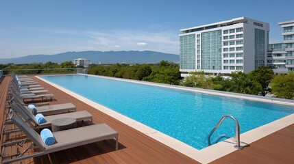 Fototapeta premium A luxurious rooftop pool offers stunning panoramic views of the surrounding cityscape, inviting relaxation and escape on a perfect sunny day.