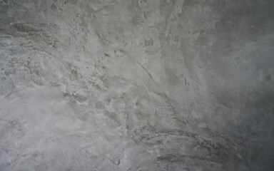 Grungy gray polished concrete wall with abstract patterns, perfect for a modern industrial or...