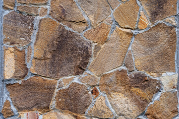 Texture of wall lined with natural stone. Template, background or wallpaper sample.