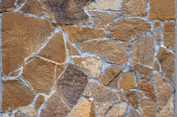 Texture of wall lined with natural stone. Template, background or wallpaper sample.