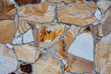Texture of wall lined with natural stone. Template, background or wallpaper sample.