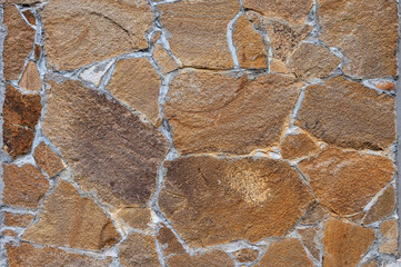 Texture of wall lined with natural stone. Template, background or wallpaper sample.