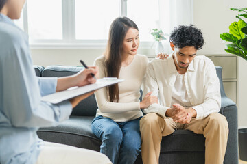 Spouses relationship consultant concept, Close-up hands of psychologist holding pen and note during...