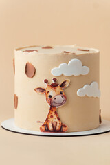 Cute African style birthday cake with beige chocolate icing decorated with edible giraffe on the beige background.