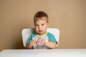 Toddler engaged in early creative exploration