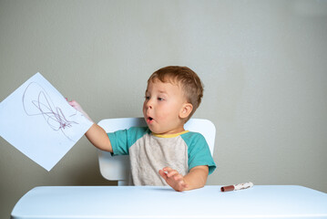 Toddler engaged in early creative exploration
