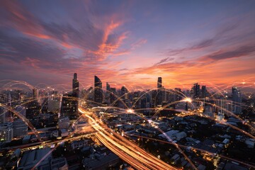 A wide shot of the Bangkok cityscape at sunset, with colorful light trails and digital lines connecting buildings across the horizon,