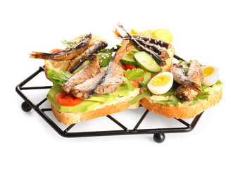 Grid of tasty sandwiches with canned smoked sprats on white background
