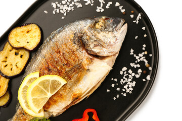 Tray with tasty grilled dorado fish on white background
