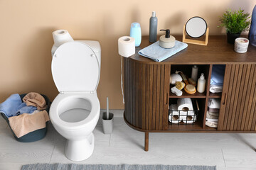 Stylish interior of modern restroom with different bath supplies