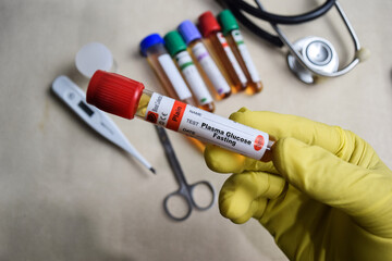 Plasma Glucose Fasting - Test with blood sample in yellow gloved hands. healthcare or Medical...