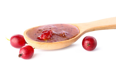 Spoon with tasty gooseberry jam on white background