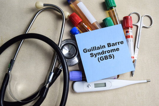 Concept of Guillain Barre Syndrome - GBS write on sticky notes isolated on Wooden Table. healthcare or Medical concept