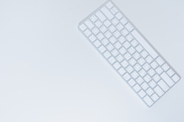 flat lay work and learn online in new normal concept from wireless keyboard on white isolated...