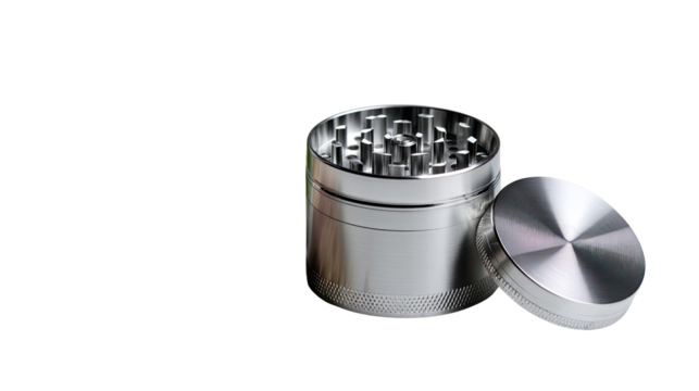Metal Grinder: A reflective grinder with its top off sitting on a plain surface.