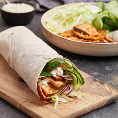 Tofu dürüm wrap with vegan yogurt sauce