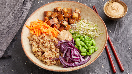 Quinoa edamame tofu bowl with red cabbage and carrots
