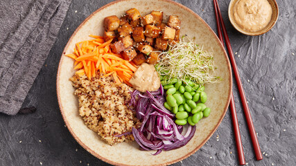 Quinoa edamame tofu bowl with red cabbage and carrots