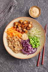 Quinoa edamame tofu bowl with red cabbage and carrots