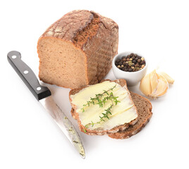 Bread slices with fresh butter, garlic and bowl of peppercorn on white background