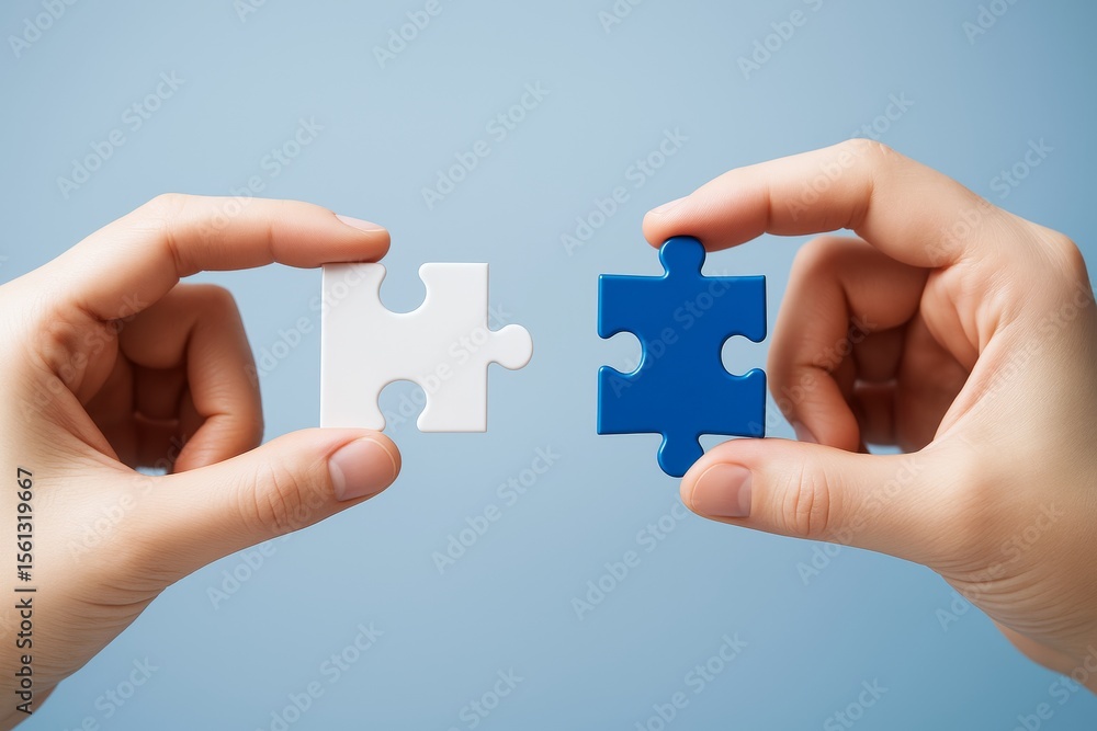 Poster two hands holding matching puzzle pieces symbolizing connection and teamwork on a light blue abstrac
