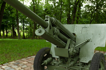 Military green cannon on the fort. Artillery weapon from the Second World War
