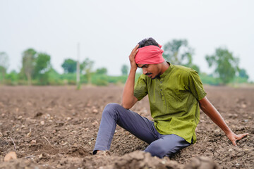 Indian farmer looking on sky and waiting for the rain