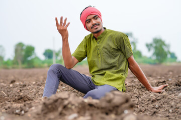Indian farmer looking on sky and waiting for the rain
