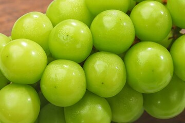 Anggur Muscat. Muscat grapes, especially the Shine Muscat variety, are a type of grape known for their distinctive sweet taste and unique muscat aroma.