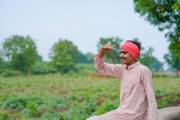 Indian farmer looking on sky and waiting for the rain