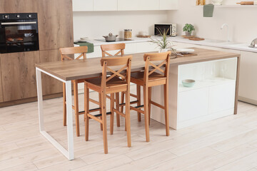 Dining table in interior of kitchen