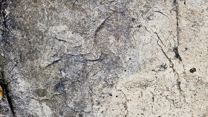 Close-up of a natural mountain rock surface featuring rough and organic textures. Ideal for use in backgrounds, design elements.
