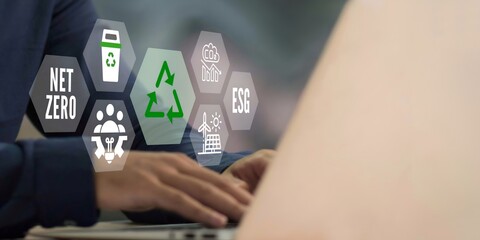 A business person using laptop with esg concept on visual screen.