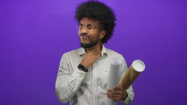 Man holding blueprints with an expression of discomfort on a purple background, wearing glasses and a smart watch, depicting an isolated architectural or design scenario.