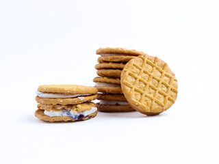 Stack of sandwich cookies with cream and blueberry filling on a white background