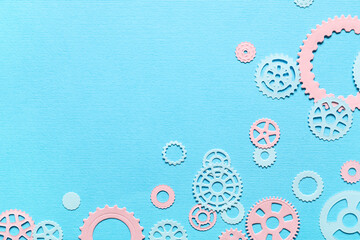 Different paper gears on blue background