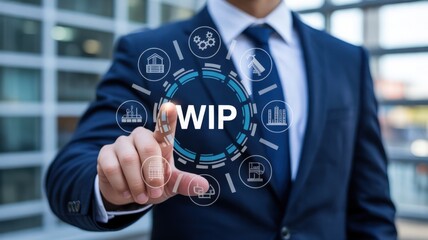 Businessman interacting with a work-in-progress graphic display.