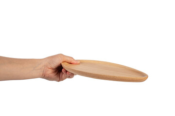 Oval wooden plate in hand on transparent background