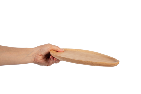 Oval wooden plate in hand on transparent background