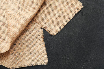 Burlap cloth on dark background