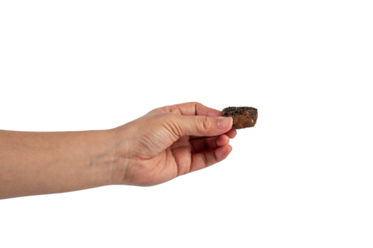 Nougat is a chocolate snack in hand on a transparent background.