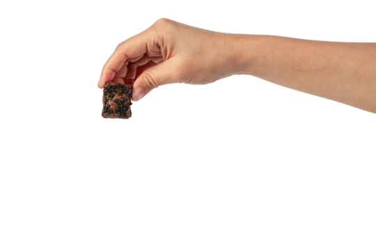 Nougat is a chocolate snack in hand on a transparent background.